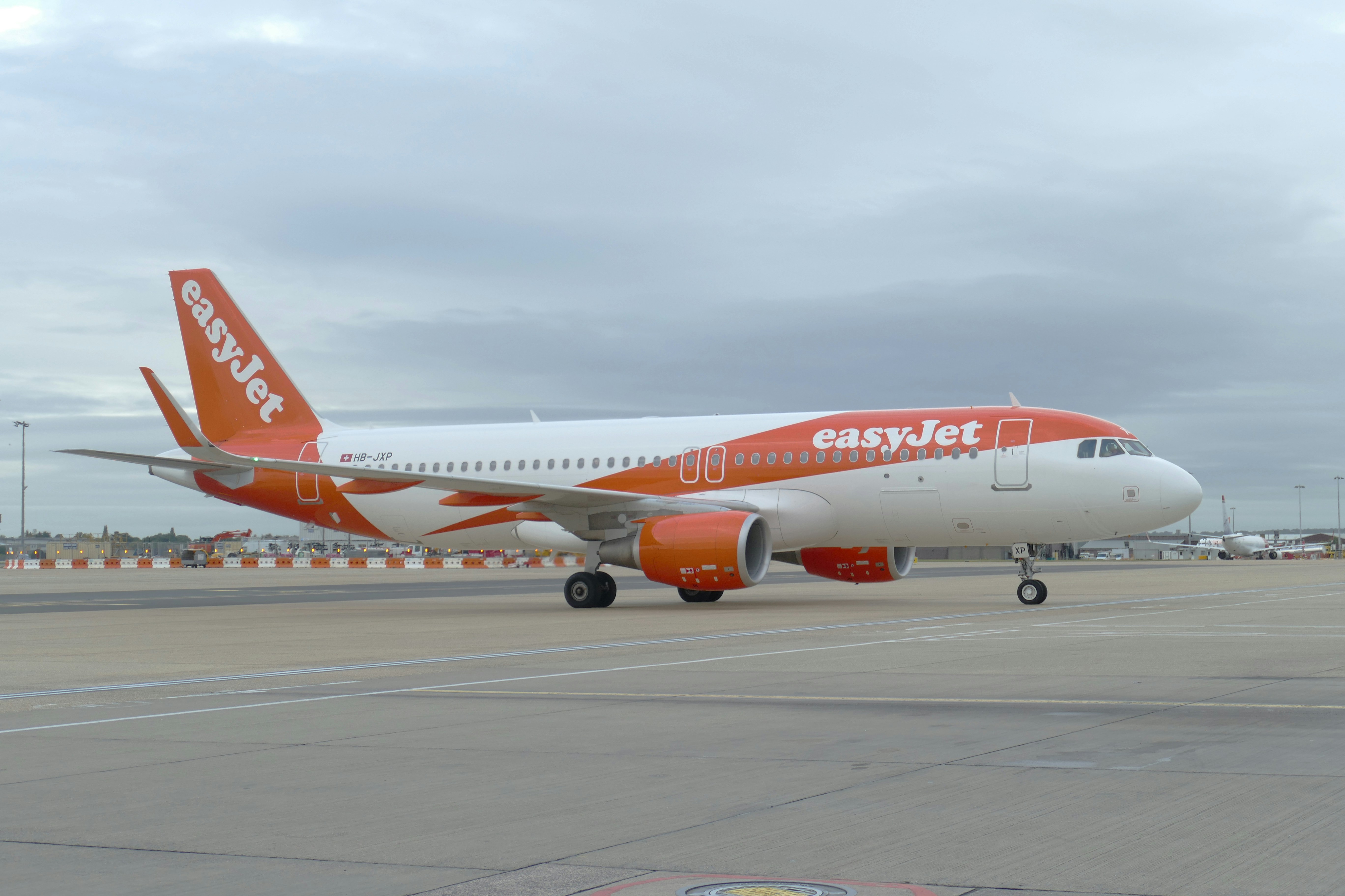 Picture of an easyJet airplane in an airport.